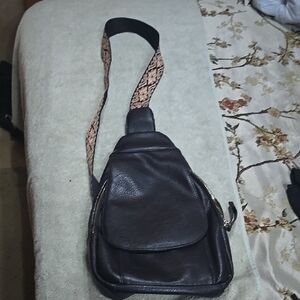 Black Crossbody Bag with Textured Leather and Unique Strap